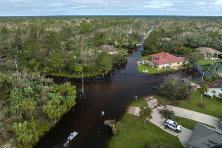 Aftermath of natural disaster. Flooded houses by hurricane Ian rainfall in Florida residential areaの写真素材