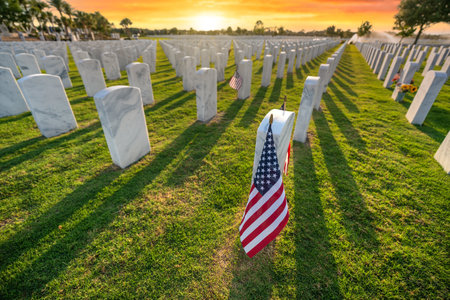 Military burial headstones. Sarasota National Cemetery with rows of white tomb stones and USA flags...
