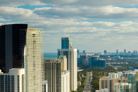 Sunny Isles Beach city with luxurious highrise hotels and condo buildings on Atlantic ocean shore. American tourism infrastructure in southern Floridaの写真素材