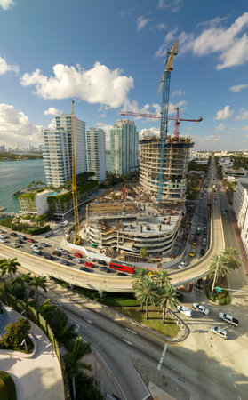 New construction site of developing residense in american urban area. Industrial tower lifting...