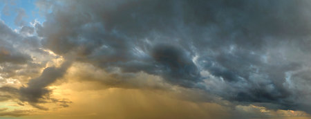 Rain shower water pouring down from stormy clouds during summer thunderstorm in Floridaの写真素材