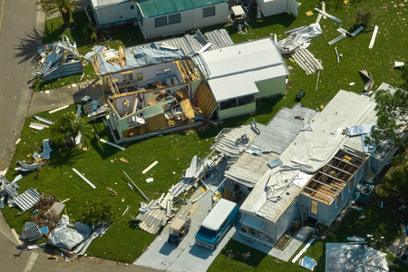Severely damaged by hurricane Ian houses in Florida mobile home residential area. Consequences of natural disasterの写真素材