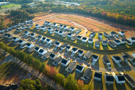 Aerial view of real estate development with tightly located family houses under construction in Carolinas suburban area. Concept of growing american suburbsの写真素材