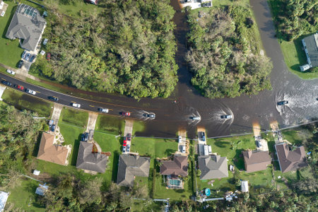 Aftermath of natural disaster. Flooded houses by hurricane rainfall in Florida residential areaの写真素材