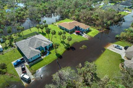 Aftermath of natural disaster. Surrounded by hurricane Ian rainfall flood waters homes in Florida residential areaの写真素材
