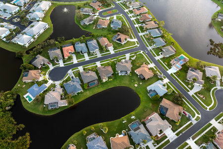 American gated community houses in rural US suburbs. View from above of large residential homes in small town in southwest Floridaの写真素材