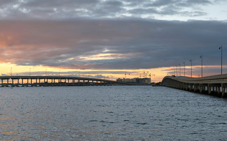 Barron Collier Bridge and Gilchrist Bridge in Florida with moving traffic. Transportation infrastructure in Charlotte County connecting Punta Gorda and Port Charlotte over Peace Riverの写真素材