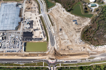 Beginning of construction works on prepared ground. Large building site in American rural area. Development of residential housing in US suburbs. Real estate market in USAの写真素材