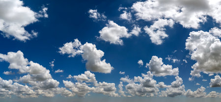 Bright landscape of blue sky with flying white clouds. Colorful summer skyscapeの写真素材