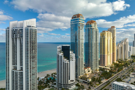 Expensive highrise hotels and condos on Atlantic ocean shore in Sunny Isles Beach city. American tourism infrastructure in southern Floridaの写真素材