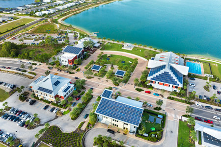 Photovoltaic panels for producing clean ecological electric energy. Florida office buildings with solar roofs. Renewable electricity with zero emission conceptの写真素材