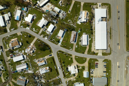Severely damaged houses after hurricane Ian in Florida mobile home residential area. Consequences of natural disasterの写真素材