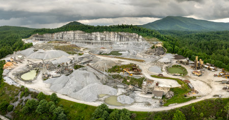 Aerial view of open pit mining site of limestone materials extraction for construction industryの写真素材