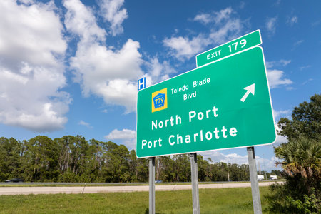 American interstate highway directional exit sign on fast motorway in Florida, USA. I-75 freeway junction leading to North Port and Port Charlotteの写真素材