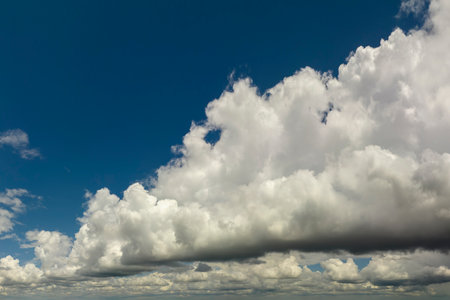Blue sky with white clouds. Bright summer skyscapeの写真素材