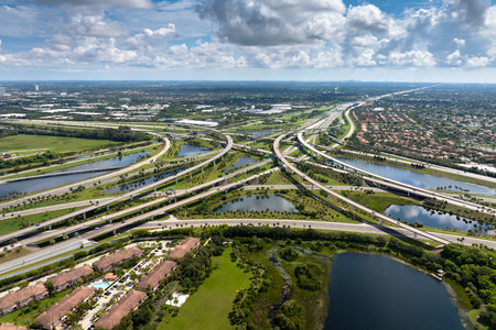 Complex highway overpass elevated direction lanes with busy traffic in Miami, Florida. American high speed road crossroadsの写真素材