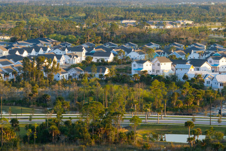 Development of residential housing in the USA. Wooden frames of new cheap American homes under constructionの写真素材