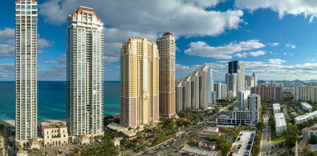 Expensive highrise hotels and condos on Atlantic ocean shore in Sunny Isles Beach city. American tourism infrastructure in southern Floridaの写真素材