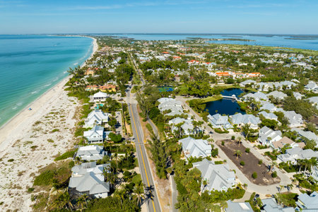 Expensive residential houses in island small town Boca Grande on Gasparilla Island in southwest Florida. American dream homes as example of real estate development in US suburbsの写真素材