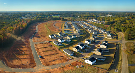 Ground prepared for building of new residential houses in South Carolina suburban development area. Concept of growing american suburbsの写真素材