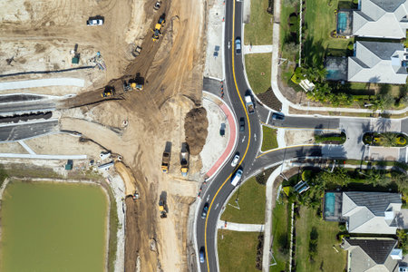 Industrial roadworks. Roundabout on wide American highway under construction. Development of transportation system for rapid transitの写真素材