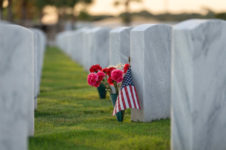Military burial headstones. Sarasota National Cemetery with rows of white tomb stones with flowers...