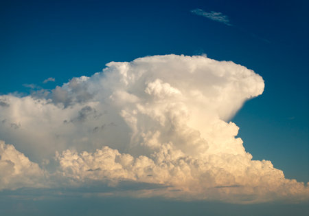 Rain clouds forming on blue sky. Colorful summer skyscapeの写真素材