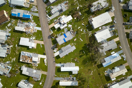 Severely damaged houses after hurricane Ian in Florida mobile home residential area. Consequences of natural disasterの写真素材