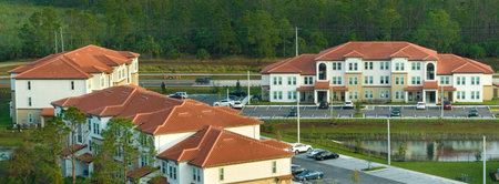 Top view of new apartment condos in Florida suburban area. Family housing in quiet neighborhood. Real estate development in american suburbsの写真素材