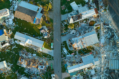 Aerial view of heavily damaged by hurricane Ian houses in Florida mobile home residential area. Consequences of natural disasterの写真素材