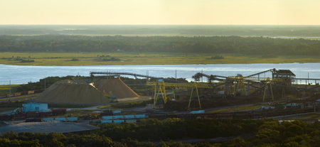 Aerial view of wood processing factory with smoke from production process polluting atmosphere at...