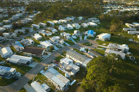 Badly damaged mobile homes after hurricane Ian in Florida residential area. Consequences of natural disasterの写真素材