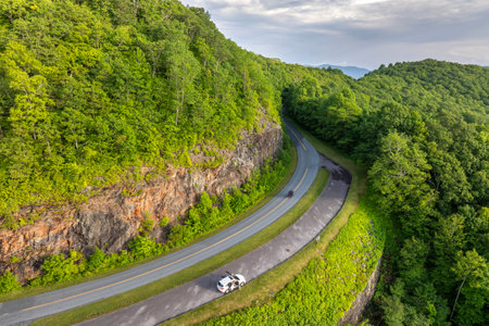 Blue Ridge Parkway road at overlook in summer woods of Appalachian mountains. Road trip driving in wild nature in summertime seasonの写真素材