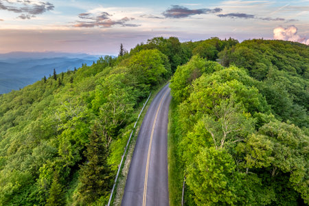 Car road trip on Blue Ridge Parkway in North Carolina Appalachian mountains in summer season at sunset. Summertime landscape of beautiful natureの写真素材
