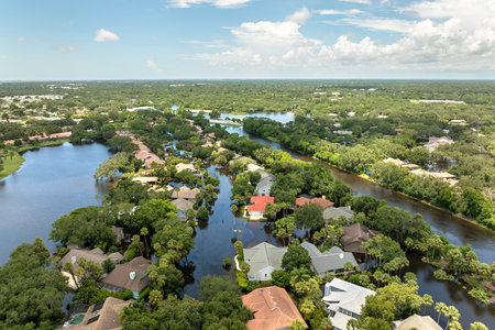 Flooded residential area with underwater houses from hurricane rainfall water in Florida suburban community. Aftermath of natural disaster in southern USAの写真素材