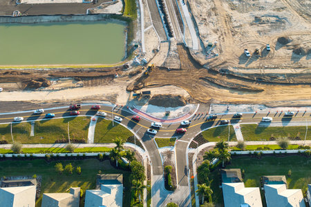 Industrial roadworks. Roundabout on wide American highway under construction. Development of transportation system for rapid transitの写真素材