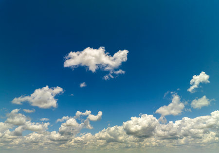 Rain clouds forming on blue Florida sky. Colorful summer skyscapeの写真素材
