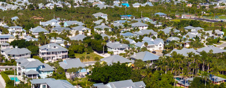 Rich neighborhood with expensive residential homes in Boca Grande, Florida. Wealthy suburban areaの写真素材
