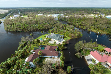 Surrounded by hurricane Ian rainfall flood waters homes in Florida residential area. Aftermath of natural disasterの写真素材