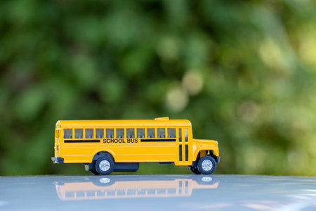 Toy american yellow school bus as symbol of education in the USAの写真素材