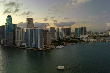 View from above of high skyscraper buildings in downtown district of Miami Brickell in Florida, USA at sunset. American megapolis with business financial district at nightfallの写真素材
