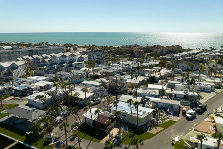 Collapsed and damaged mobile homes after hurricane Ian swept through Florida residential area. Consequences of severe natural disasterの写真素材