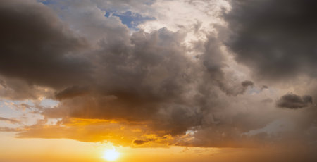 Evening sunset sky with colorful clouds. Panoramic skyscapeの写真素材