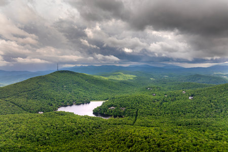 Grandfather Lake in mountain forest with green canopies in summertime season. North Carolina wild woods nature in summerの写真素材