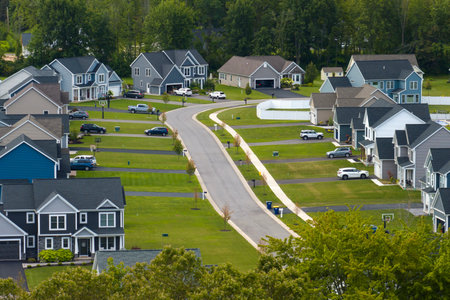 Housing market in the USA. Residential homes in suburban sprawl development in Rochester, New York. Low-density two story private houses in rural suburbsの写真素材