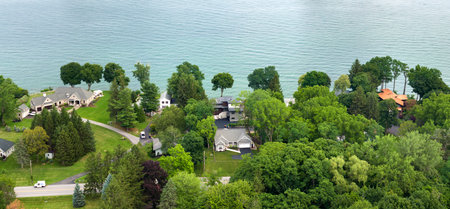 Large waterfront private homes in Rochester, NY residential area on lakeside Ontario. New family houses as example of real estate development in American suburbsの写真素材