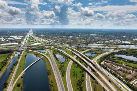 Massive highway intersection in American city area. Stacked elevated interchange lanes for express passing of car traffic. Miami, Floridaの写真素材