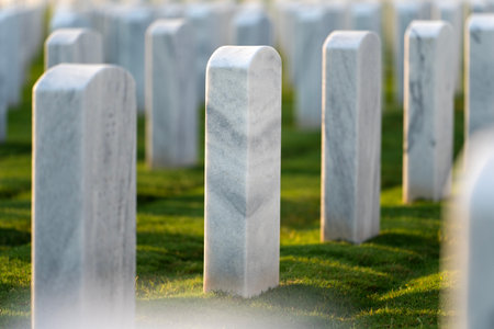 Memorial Day concept. Sarasota National Cemetery with rows of white tomb stones on green grassの写真素材
