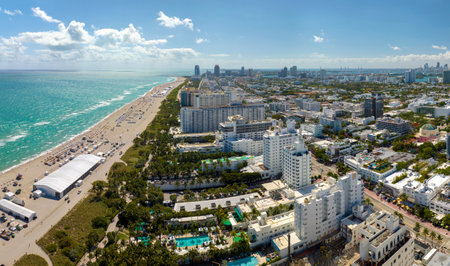 Miami Beach city with high luxury hotels and condos and sandy beachfront. High angle view of tourist infrastructure in southern Florida, USAの写真素材