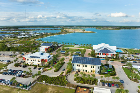 Photovoltaic panels for producing clean ecological electric energy. Florida office buildings with solar roofs. Renewable electricity with zero emission conceptの写真素材